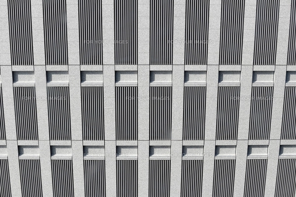 ガラスの鏡張りのオフィスビルのファサードテクスチャ。ファサードの断片。レンズフレアフィルター効果を備えた夕焼けの光の中でビジネス地区の近代的な高層ビルの下のビュー。写真素材2329408309Shutterstock