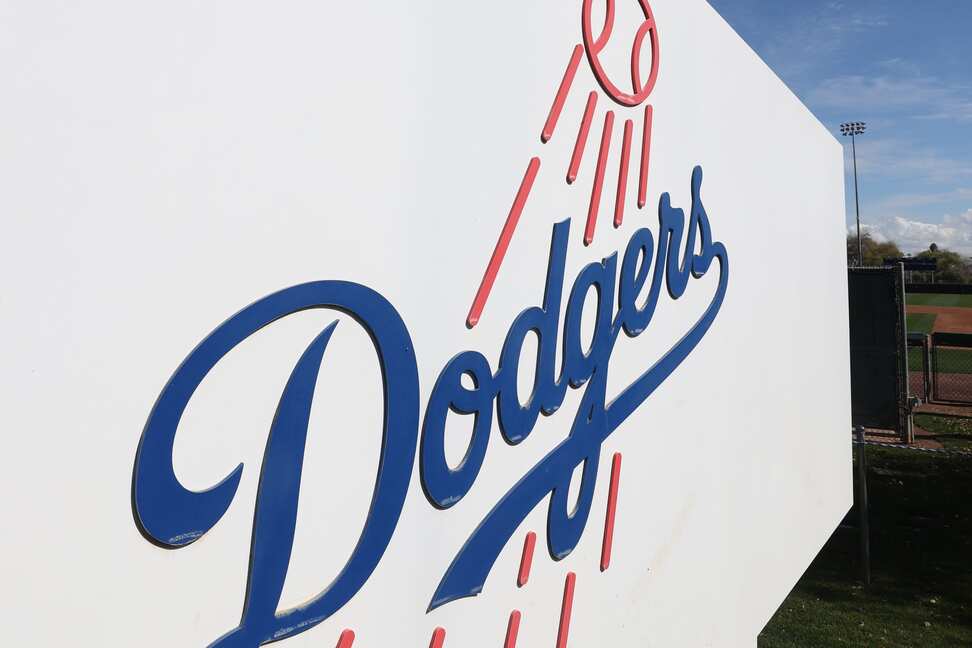 Milwaukee Brewers Logo in Blue and Gold on Brown Background